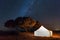 Camp with tent in the desert among sandy dunes. Night with stars in the Sahara, Morocco