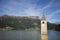 Campanile di curon venosta vecchia or Submerged tower of reschensee church deep in Resias Lake at morning in Trentino-Alto valley