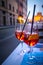 Campari Aperol Spritz cocktail on a table in cafe / restaurant outdoors view of Castle of Holy Angel in Rome