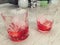 Campari served in two crystal glass with ice cubes