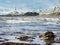 Campbell Point lighthouse with stormy Pacific ocean and kelp seaweed