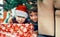 We camped out overnight to get to these. Portrait of two adorable brothers playing under the Christmas tree at home.