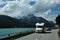 A Camper is driving along the glacier lake Silvaplana