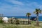 Camper, mobile home or caravan vacation, free parking of beach with palm trees and blue sea