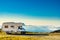 Camper on mountain peak above clouds, Portugal