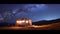 A camper parked in a field under a starry sky. AI generative image.