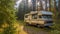 a camper parked in a forest