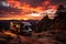 A camper parked on wheels in the mountains at sunset, beautiful landscape. travel concept