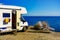 Camper rv on sea with clothes to dry