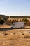 Camper van in Alentejo landscape with abandoned destroyed Ajuda bridge behind, in Portugal