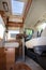 Camper van motorhome inside new modern wood interior in dealership showroom