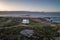 Camper van motorhome with solar panels drone aerial view on a sea landscape with mountains living van life in Galiza, Spain