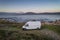 Camper van motorhome with solar panels drone aerial view on a sea landscape with mountains living van life in Galiza, Spain