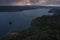 Campervan camping on lonely shore of a lake on the Wilderness Road in northern Sweden during sunset from above