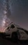 Campervan under the milky way, vertical composition