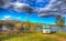 Campervan wildcamping in Scotland by Scottish Loch Garry UK with mountains colourful HDR