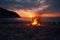 A campfire on the beach at sunset is a picturesque scene of a warm, crackling fire against the serene backdrop of the