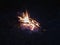 Campfire at night, burning dead trees, photo taken in the UK