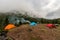 Campground in the mountains overgrown with forest.