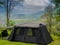 Campground Outdoor tent camping picnic on mountain with Equipment, Natural Camping area landscape background, with trees and green