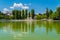 Campina, Romania - August 16, 2018: view of the cursed Bride`s Lake or the Church Lake showing green trees and water fountain sit