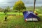 Camping activities in rain-filled holiday. Tent on campsite by the hill in rainy day. Tent wet after rain. Water droplets on the