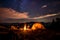 Camping activity, camper setting a yellow tent in the moutains, chairs by campfire, beautiful and majestic landscape at night, sky