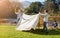 On a camping adventure with the guys. a group of young boys putting up their tent on a camping trip.