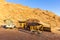 Camping in Africa with wooden shelter cabin in desert sunrise