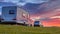 Camping caravans and cars sunset crop