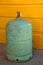 Camping gas container, green over yellow