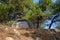 Camping grey tent on the edge of a cliff above the sea