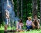 Camping and hiking. Company friends relaxing and having snack picnic nature background. Company hikers relaxing at