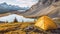 Camping with holding cup in yellow tent open with Peyto Lake in Icefields Parkway at Canada