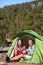 Camping people - couple eating in tent happy