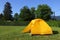 Camping picnic yellow tent campground in outdoor.