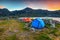 Camping place near alpine lake at sunset, Retezat mountains, Romania