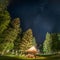 Camping Shelter at Starry Night Surrounded by Trees