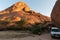 Camping site at Spitzkoppe. A vehicle and tent are visible