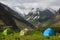 Camping tent in himalayas under beautiful blue sky