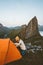 Camping tent in mountains woman traveling in Norway