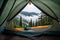 Camping tent in a nature hiking spot. view from inside the tent