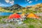 Camping and tent near alpine lake in the mountains, Romania