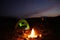 Camping tent near small bonfire