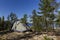 Camping tent standing on beautiful lake coastline. Karelia, Russia