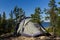 Camping tent standing on beautiful lake coastline. Karelia, Russia