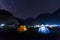 camping tent under milkyway with twinkling stars in the background