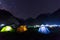 camping tent under milkyway with twinkling stars in the background