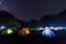 camping tent under milkyway with twinkling stars in the background