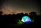 Camping tent under night sky stars